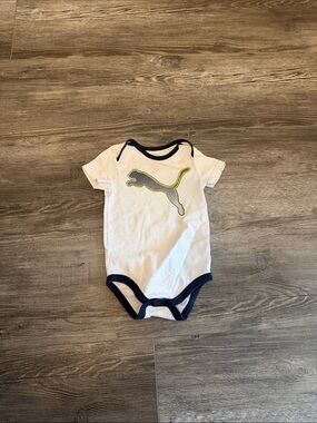 Puma White Bodysuit with Navy Trim and‎ Yellow Logo